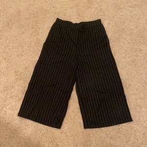 Cropped black stripe pants.